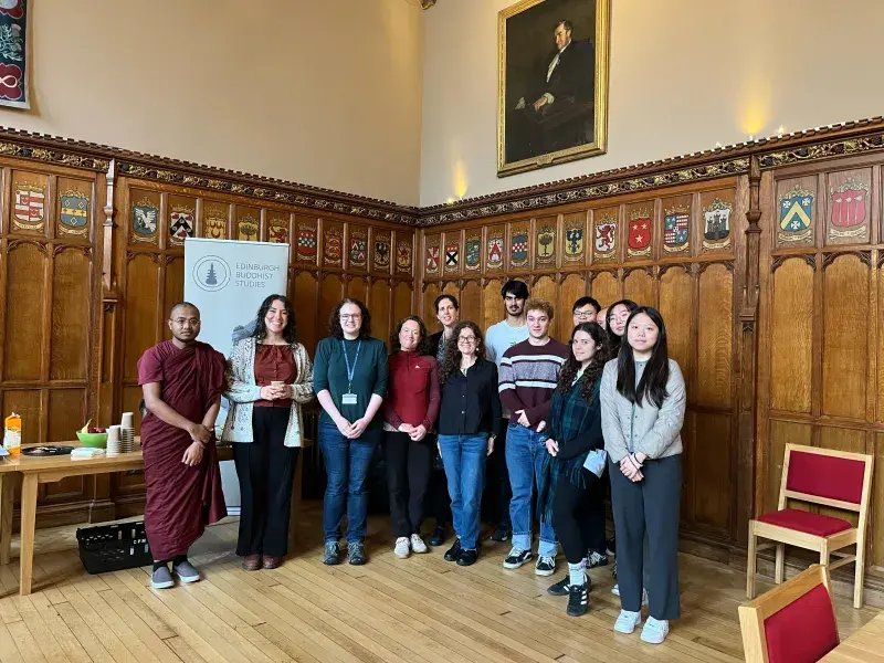 A group of people standing in a hall