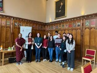 A group of people standing in a hall